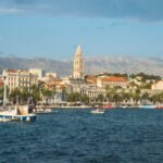 Stunning view of Split's old town and waterfront with mountains in the background, ideal for travel inspiration.
