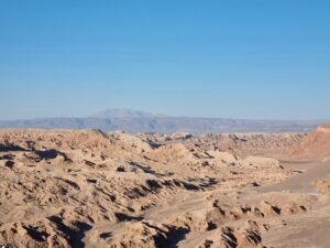 Scenic landscape of the Atacama Desert under a clear blue sky in San Pedro de Atacama, Chile.